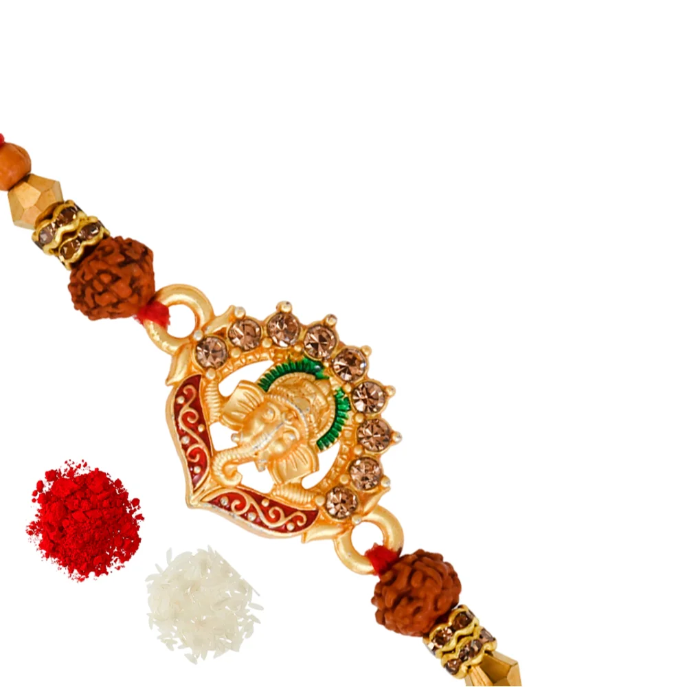 The Gift Tree Golden Ganpati Floral Rakhi For Brother With Roli, Chawal and Beautiful greeting card | Premium Rakhi for Men, Kids & Boys 1 The Gift Tree Golden Ganpati Floral Rakhi For Brother With Roli, Chawal and Beautiful greeting card | Premium Rakhi for Men, Kids & Boys