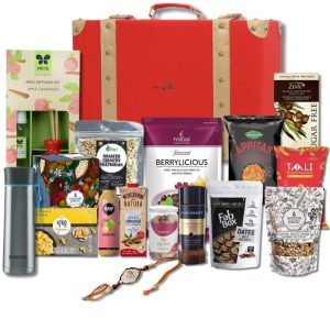 The Gift Tree Ultimate Indulgenge Leatherite Trunk Rakhi Gift Hamper | SS Bottle, Coffee, Chocolate, Berrylicious, Ragi Chips, Popcorn & Almond Milk | Silver Premium Shree Rakhi